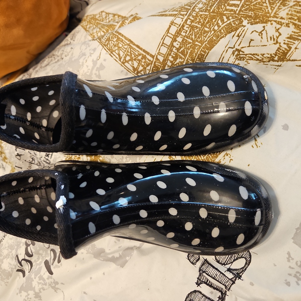 Rain booties. Brand new.   Just tore tag off.   Don't like